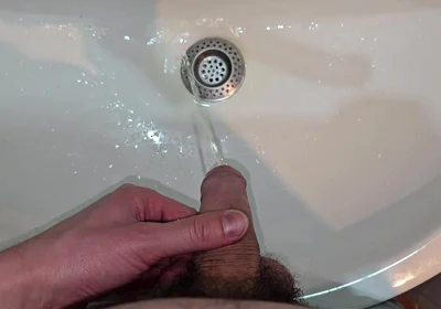 Hairy Cock Peeing Into the Sink in Bathroom with a Strong Stream