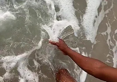 Having Fun on the Beach of Cotonou Alone for the First Time