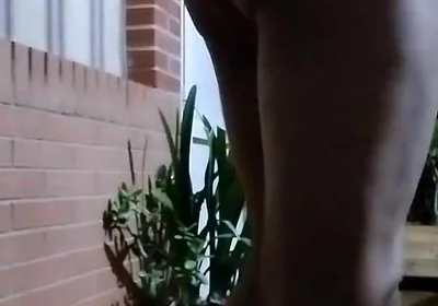 In the Doorway in a Thong and with an Anal Plug