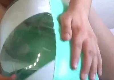 Playing with a Green and White Swimring