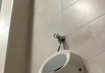 Amateur Twink Boy and Older Guy Caught Having Risky Fun in the Pool's Public Toilets