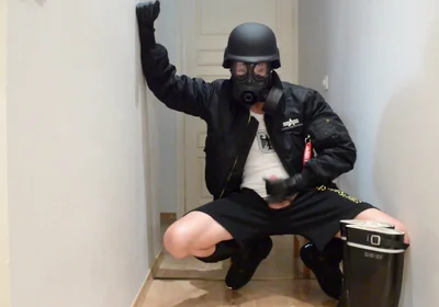 Gas masked guy cums on his rubber boots