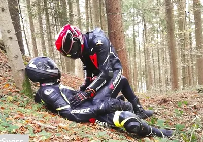 German dainese bikers having fun in the wood