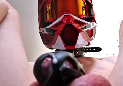 A Puppy Rides a Dildo Wearing a Helmet.