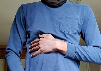 Masturbating