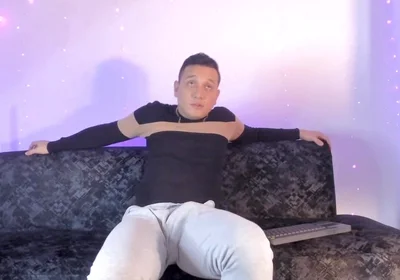 Latino Shows off His Bump on Camera Inside His Gray Sweatshirt