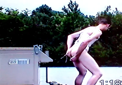 Crossdresser Riding a Giant Dildo on a Roof Top