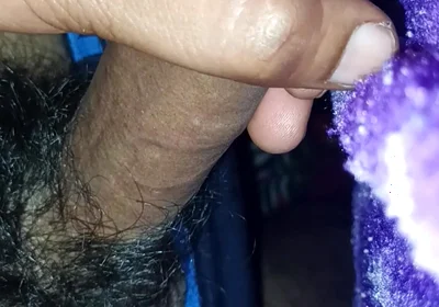 A Indian Young Boy Is Playing with His Penis Inside a Blanket