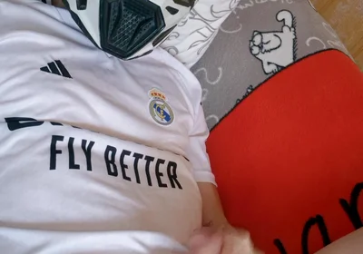 The Guy Is Wearing a Soccer Uniform and Mxhelmet with a Morning Cum