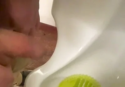 Amateur Redhead Guy Caught Pissing in a Public Toilet's Urinal - He Then Quickly Plays with His Cock Before Leaving
