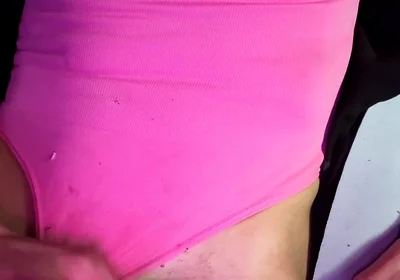Crossdresser Michelle Wearing Pink Bodysuit While Playing with Cock