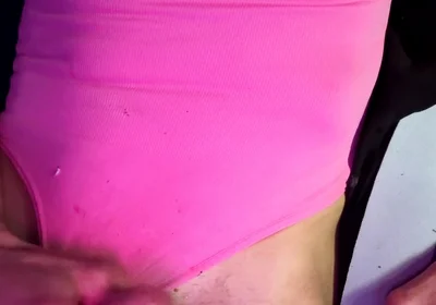 Crossdresser Michelle Wearing Pink Bodysuit While Playing with Cock