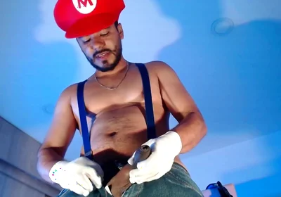 Dressed as Mario Bros Playing with His Plumbing Tool