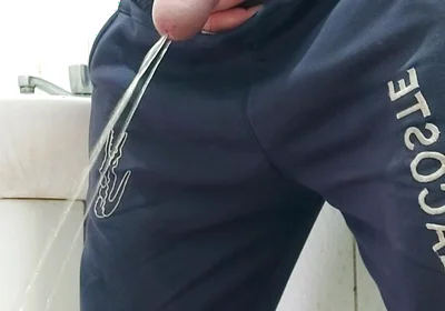 A Well-endowed Brazilian Man Urinating and Showing His Thick Penis to His Female Friends.