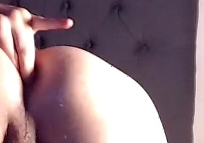 A Young Man with Fair Skin and Delicate Features Rests on the Bed