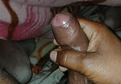 Big Boss massaging penis oil under the blanket