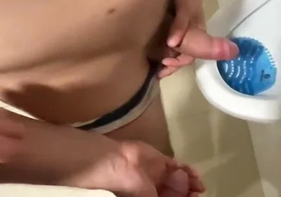 2 Boys Having Fun at the Pool Public Toilets' Urinal