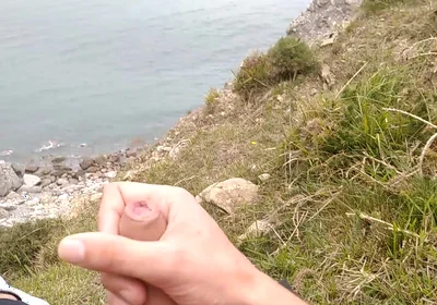 Big Beautiful Big Fat Cock Gets Handjob on the Beach with Gorgeous Sea Views
