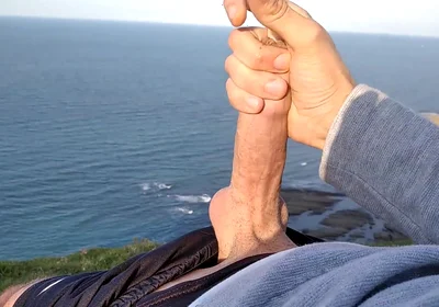 Huge Dirty Cock Gets Handjob on the Beach and Squirts a Lot of Thick Sperm in Front of the Beach