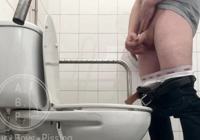 In the Hospital Toilets, a Guy Pisses Into a Cup for a Urine Sample, Then Gets Horny, Jerks-off and Cums