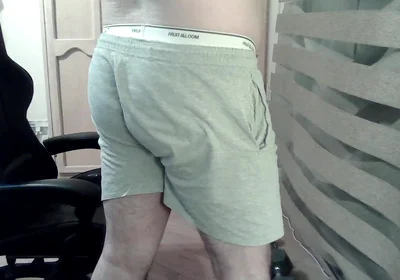 Muscular Camboy Flexes His Muscles and Squats