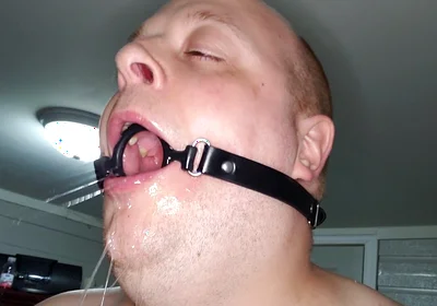 Deepthroating a 7 Inch Dildo with Mouth Gag Ring