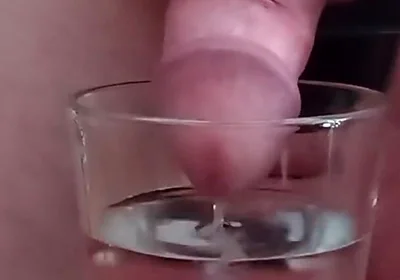 Cumming in a glass of hot water
