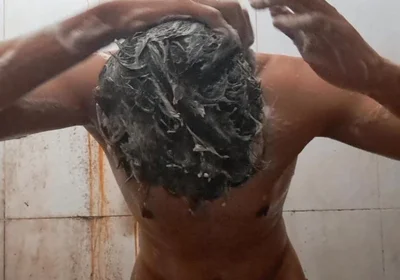 Exotic Skinned Adult Man Taking a Bath in the Afternoon