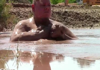 Deep, Creamy Brown Mud Bath in a Sand Pit