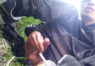 Gay boy Jon Arteen, wearing adidas tracksuit Campus sneakers, gets a hard-on outdoors