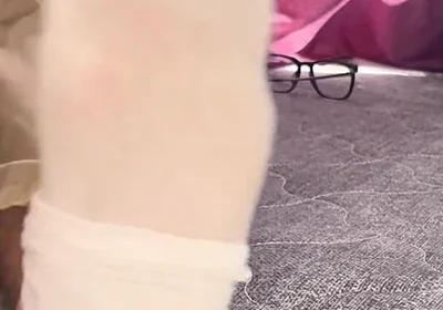 A University Rests Her Feet on Her Face so That the Adorers
