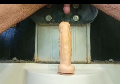 Mulatto Jumps on a Dildo and Pisses