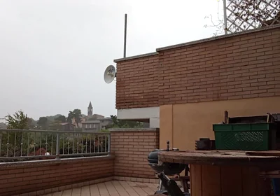 On the Terrace, in the Rain