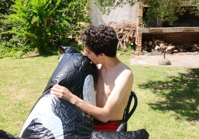 Beautiful Man Inflates His Inflatable Whale Near Pool Outside