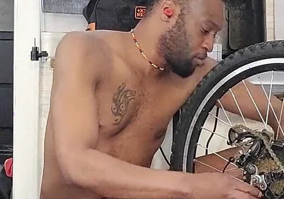 Kennie Jai Does a Nude Bike Repair. Watch That Big Dick Swing!