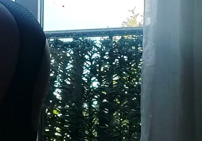 In Lingerie and Heels at the Window with a Toy