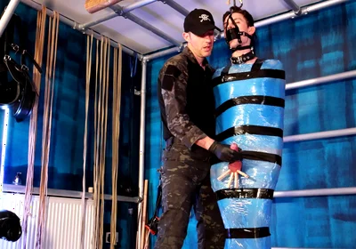 Twink Slave Bound in Pallet Wrap for Orgasm Control