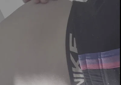 Young Man Holds a Full Bladder