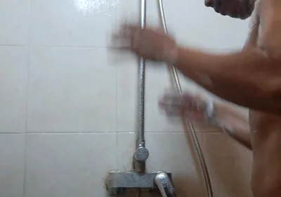 Exotic Skinned Asian Adult Man Taking a Shower in the Morning