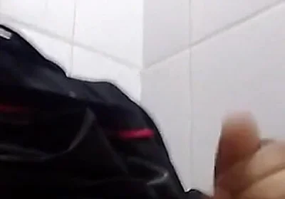 Man Sits in the Bathroom