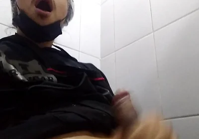 Man Sits in the Bathroom